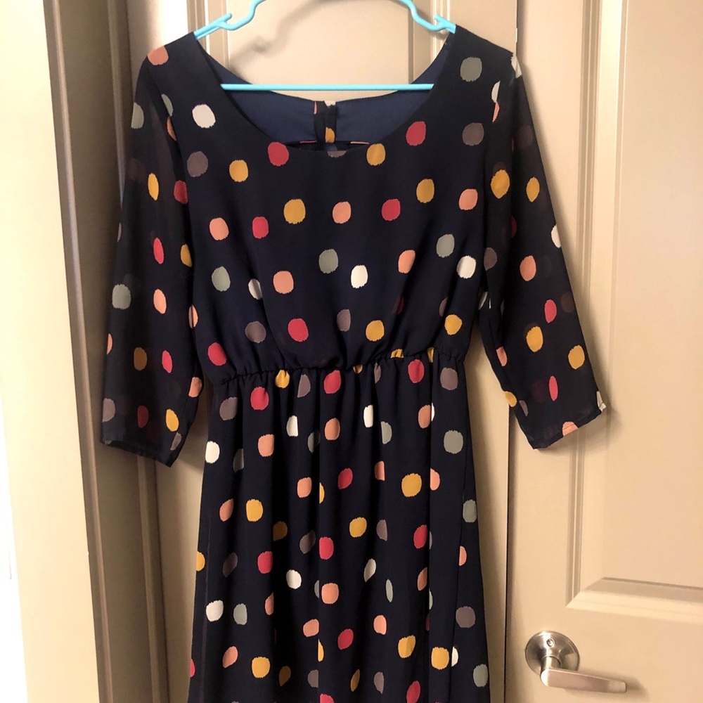 Boutique dress with bow on back.